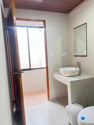 a bathroom with a sink and a mirror at Bajamar, Puntarenas in Puntarenas