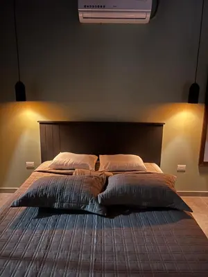a bedroom with a large bed with two pillows at Cachorro, Puntarenas in Puntarenas