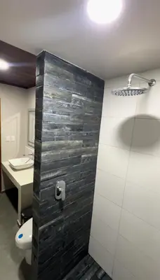 a bathroom with a toilet and a sink at Cachorro, Puntarenas in Puntarenas