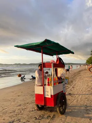 a man in a food cart on the beach at The Backside House - Women Only - in Tamarindo