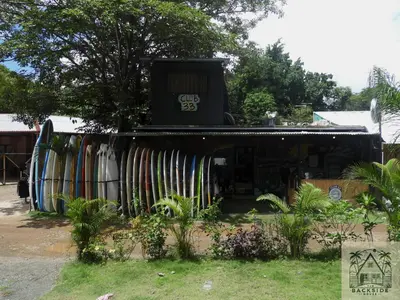 a store with a bunch of surfboards on display at The Backside House - Women Only - in Tamarindo