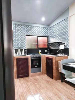 a kitchen with a stove and a sink in a room at Casa vacacional Brisa Del Mar in Coco
