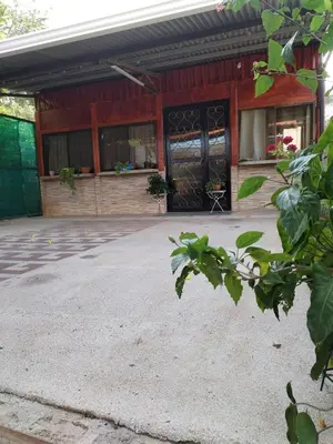 a large red building with a black door at Casa vacacional Brisa Del Mar in Coco