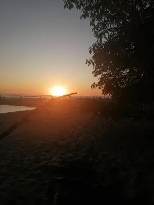 a sunset with the sun setting in the distance at Guanacaste Azul in Santa Cruz