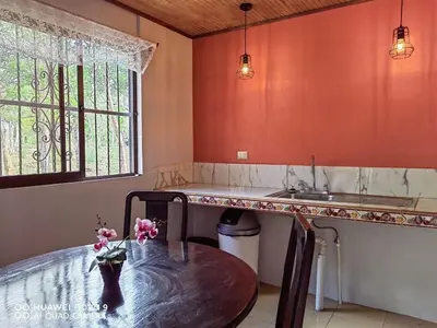 a kitchen with a table and a sink at Guanacaste Azul in Santa Cruz