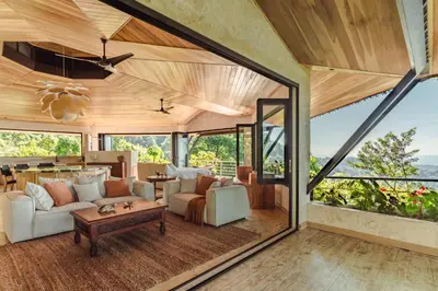 a living room with a couch and a table at Arbórea Villas in Chontales