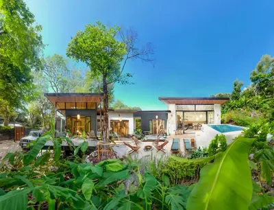 an exterior view of a house with a garden at Ikiru House in Santa Teresa Beach