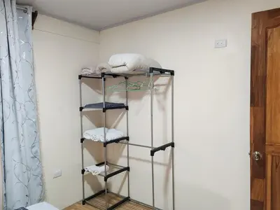a towel rack in a room with towels at Villas Los Titos in La Fortuna in San Francisco