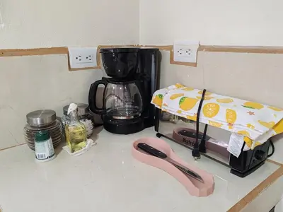 a kitchen counter with a coffee maker on a counter at Villas Los Titos in La Fortuna in San Francisco