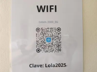 a sign for a wii game on a wall at Villas Los Titos in La Fortuna in San Francisco