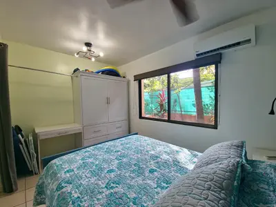 a bedroom with a bed and a window at A little bit of Paradise Ground Floor Studio in Coco