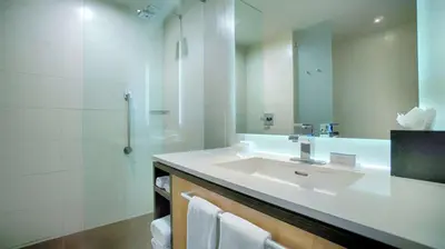 a bathroom with a sink and a shower at Hilton Garden Inn San Jose La Sabana, Costa Rica in San José