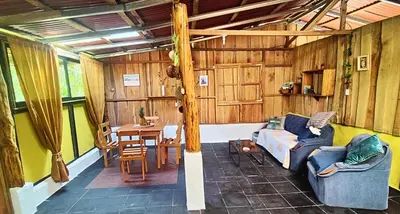 a living room with a couch and a table at Wild Nest Chirripo in Rivas