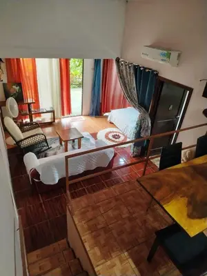 a living room with a couch and a table at Casa veranera in Sarapiquí