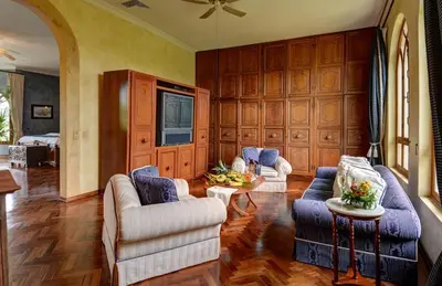 a living room with two couches and a tv at El Castillo de Esparza in Esparza