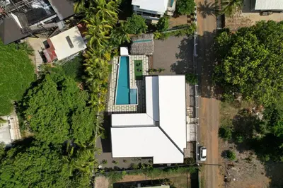 an overhead view of a white building with a pool at Casa Las Olas in Esterillos