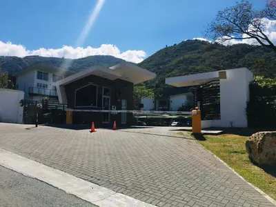 a house being constructed with orange cones in front of it at Brisa del Río Santa Ana in Río Oro