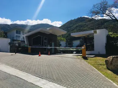 a house under construction with orange cones in front of it at Brisa del Río Santa Ana in Río Oro