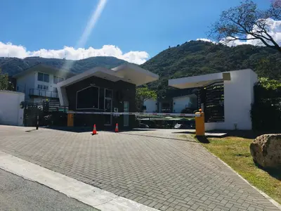a house being constructed with orange cones in front of it at Brisa del Río Santa Ana in Río Oro