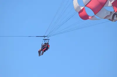 a person hanging from a parachute at Yireth Studio in Quepos