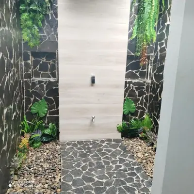 a vertical garden with plants on a wall at Elegant studio in Fortuna