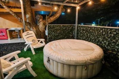 a room with a table and two chairs and a barrel at Villa jr 1 Private Jacuzzi near peñon guacalillo in Tivives