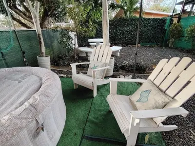 two rocking chairs and a table and a bed at Villa jr 1 Private Jacuzzi near peñon guacalillo in Tivives