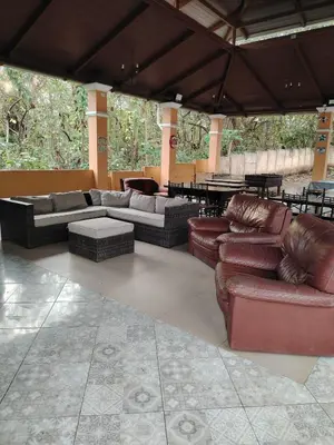 a living room with couches and tables and a patio at Villa jr 1 Private Jacuzzi near peñon guacalillo in Tivives
