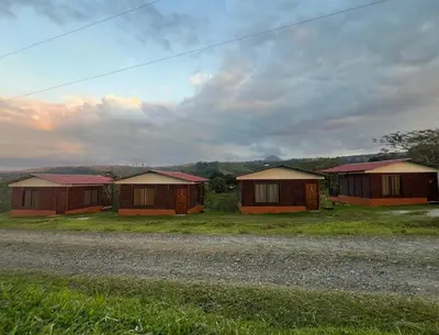 a row of houses on the side of a road at Cabaña 3 venado in Venado