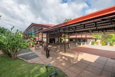 a building with a red roof and a patio at Quinta Issazu in Juntas
