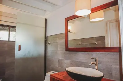 a bathroom with a sink and a mirror at CASA NiCO in Río Sequito