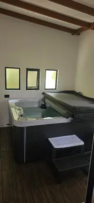 a room with a bath tub in the corner of a room at Historias Lodge in Monteverde Costa Rica