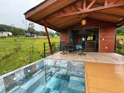 a house with a swimming pool on a deck at EcoVilla with Pool & HotSprings in Fortuna