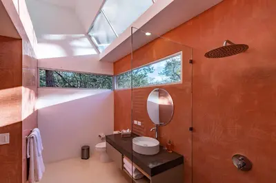 a bathroom with a sink and a mirror at Green House 1 in Nosara