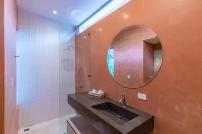 a bathroom with a sink and a mirror at Green House 1 in Nosara