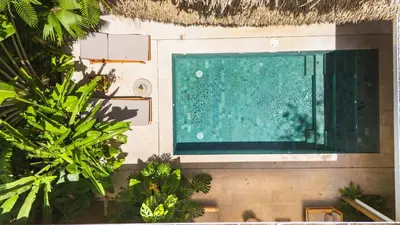 an overhead view of a swimming pool in a house at Green House 1 in Nosara