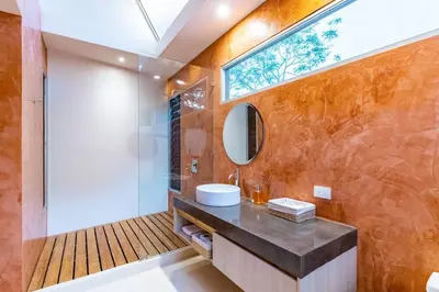 a bathroom with a sink and a mirror at Green House 2 in Nicoya