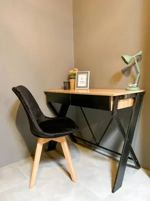 a desk with a black chair and a lamp at Casitas la Esquina in Monteverde Costa Rica