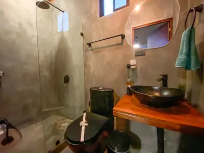 a bathroom with a sink and a shower at Casitas la Esquina in Monteverde Costa Rica