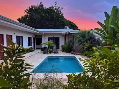 a house with a swimming pool in the yard at Hotel Huacas in Huacas