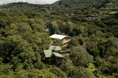an aerial view of a house in the forest at Cala Lodge in Monteverde Costa Rica