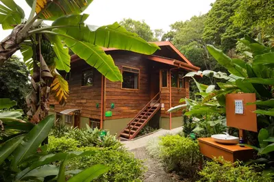 a wooden house in the middle of a forest at Cala Lodge in Monteverde Costa Rica