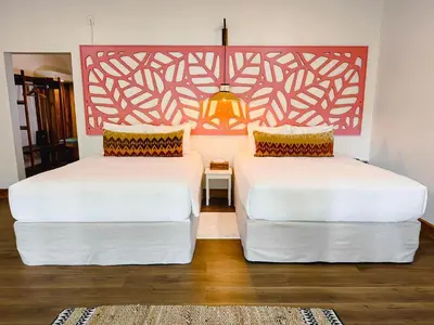 two beds sitting next to each other in a room at Cloud Forest Lodge in Monteverde Costa Rica