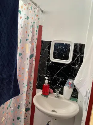a bathroom with a sink and a window at Casita Campos in Sarapiquí