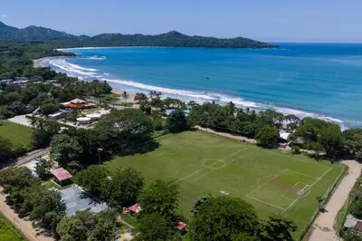 an aerial view of a soccer field next to the beach at Suite 3 Jaguar - Beach & Pool 2 BR Condo in Brasilito