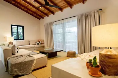 a living room with a couch and a table at Rincon Escondido in Nosara