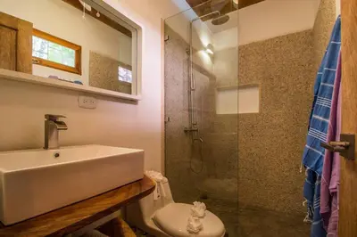 a bathroom with a sink and a shower at Casa Jose in Nosara