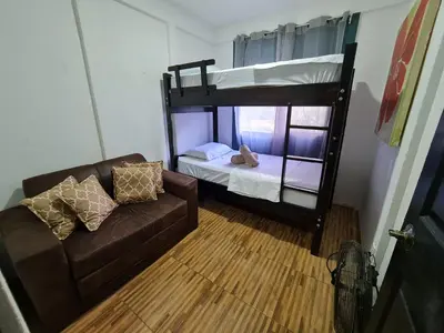 a living room with a couch and a bunk bed at Casa del Sol Playa Avellanas in San José Pinilla