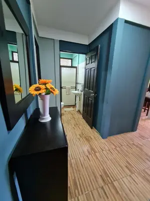 a hallway with a vase of flowers on a table at Casa del Sol Playa Avellanas in San José Pinilla