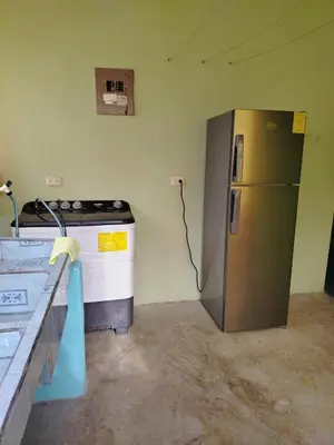 a kitchen with a refrigerator and a stove at Casa Marina in Pedregal